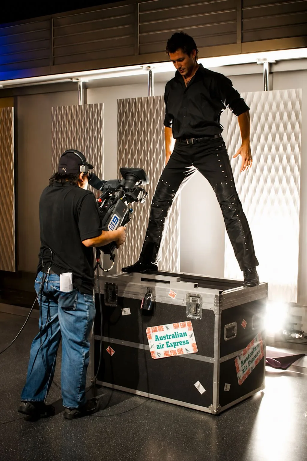 Sam Powers atop the Australian Air Express flight case that carried his illusions overnight to Channel 9