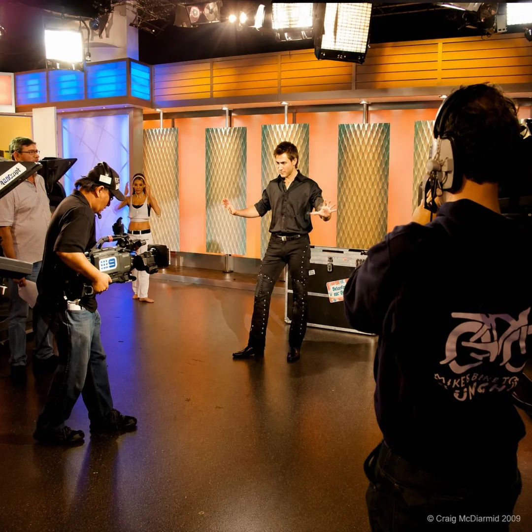 Sam Powers performing live in the Today Show studio surrounded by the Channel 9 camera crew